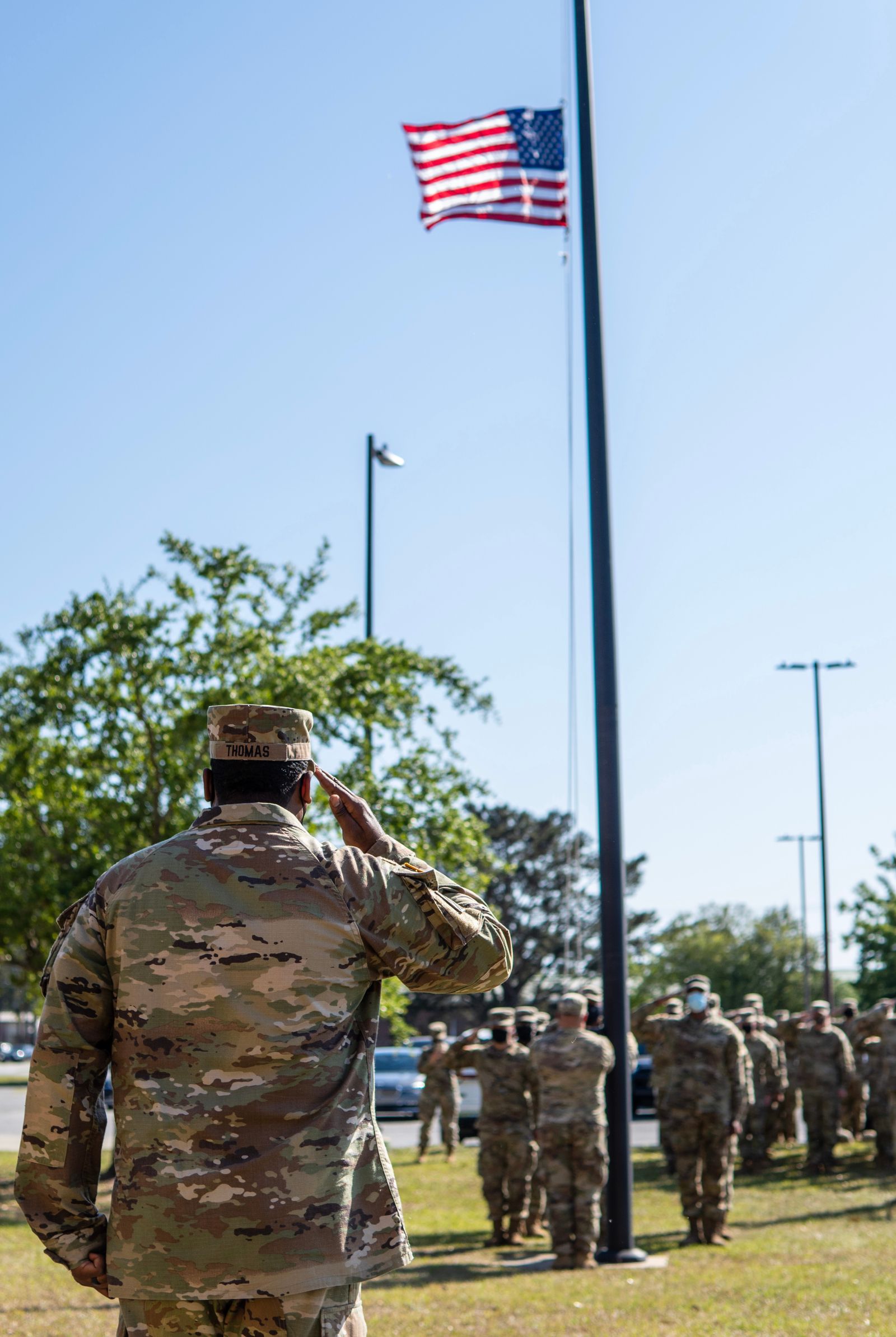 Soldier saluting the American flag